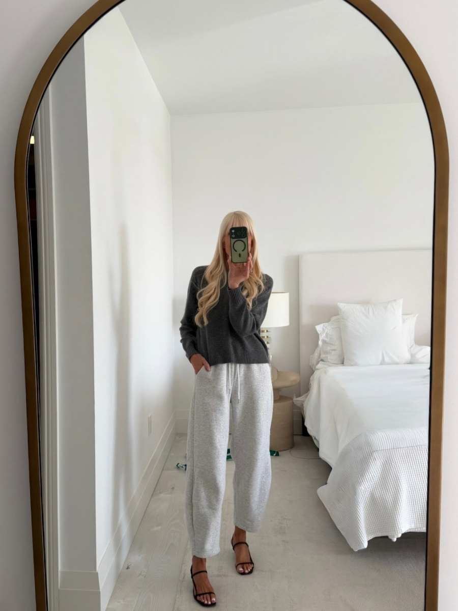 Mary Murnane wearing neutral sweatpants paired with pointed-toe heels and a clean, structured knit top, showcasing a modern classic way to style sweatpants in a polished, elevated way.