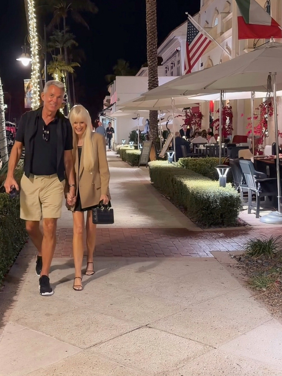 Couple walking down the street after a dinner date.