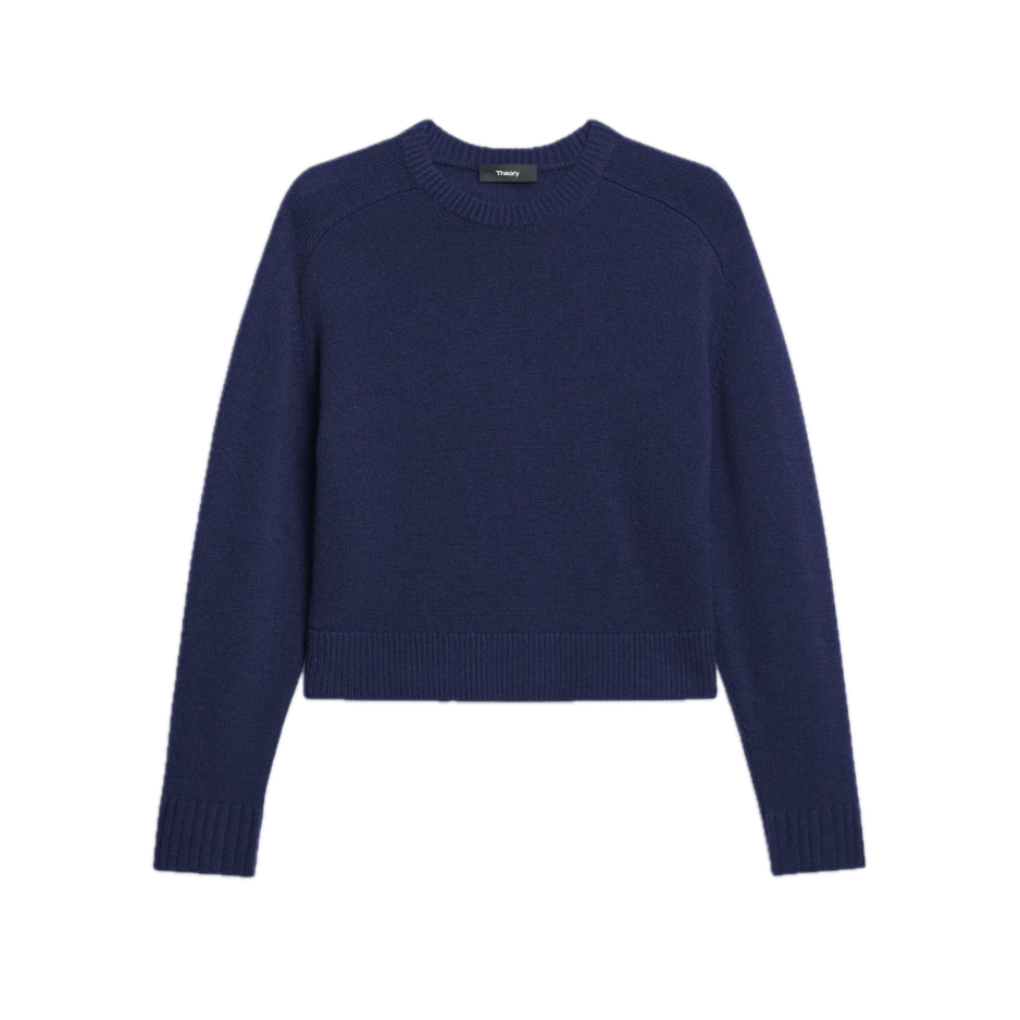 A rich navy crewneck sweater by Theory in a relaxed cropped fit. Ribbed cuffs, hem, and neckline accent the chunky, textured knit. A versatile and refined casual essential.
