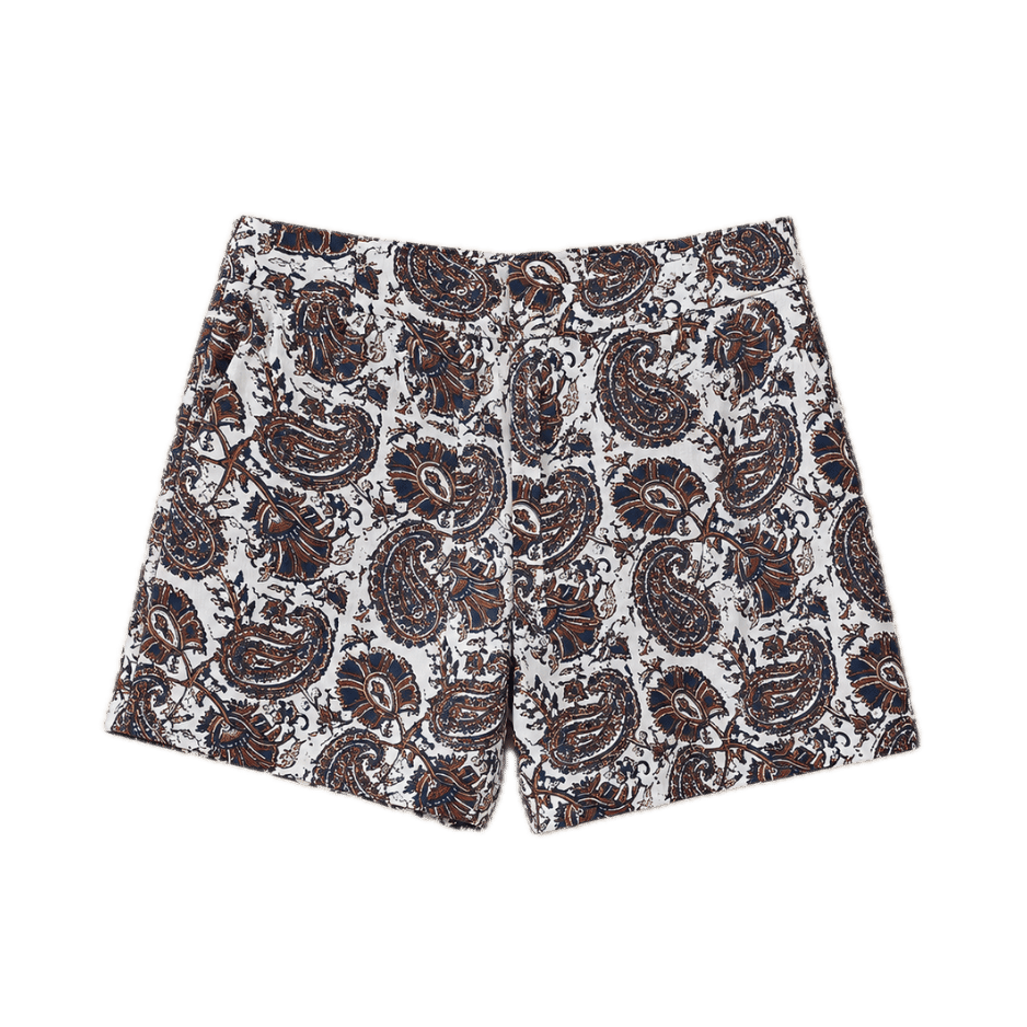 High-waisted shorts in a bold navy and brown paisley print on a white ground. Tailored with a clean front and no visible closures — a chic, statement printed short.