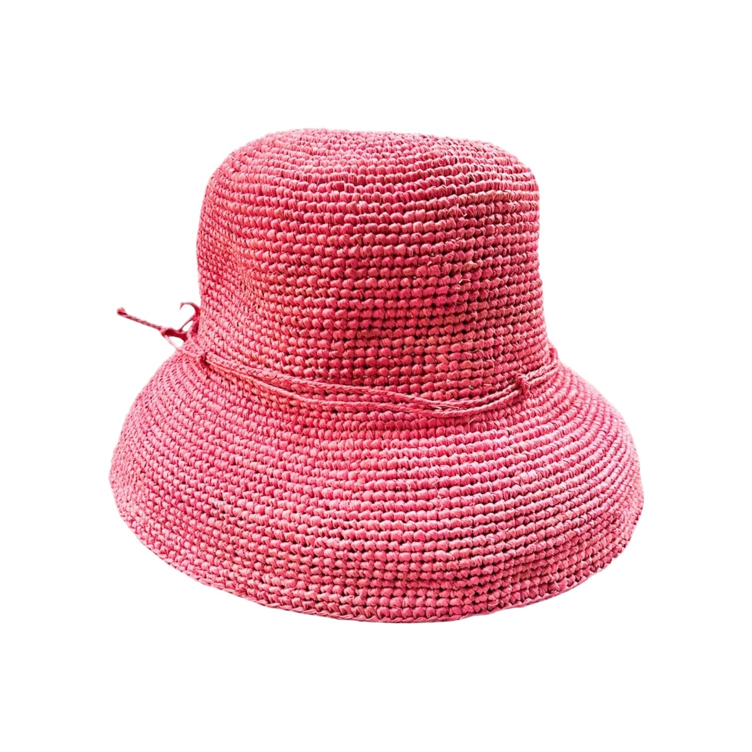 A vibrant hot pink crochet raffia bucket hat with a chunky, open-weave texture and a gently flared brim. A tonal raffia tie detail sits at the side of the crown, adding a sweet, playful accent to this bold summer statement hat.